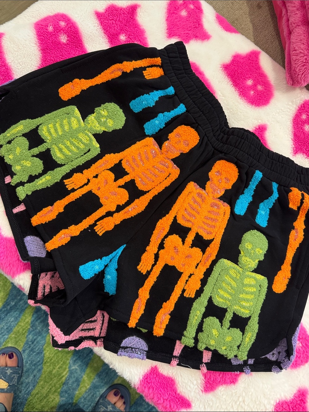QUEEN OF SPARKLES Black Shorts with Orange, Green & Blue Skeletons